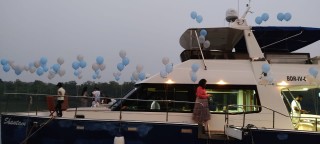 Balloon Decoration on Blue White Catamaran